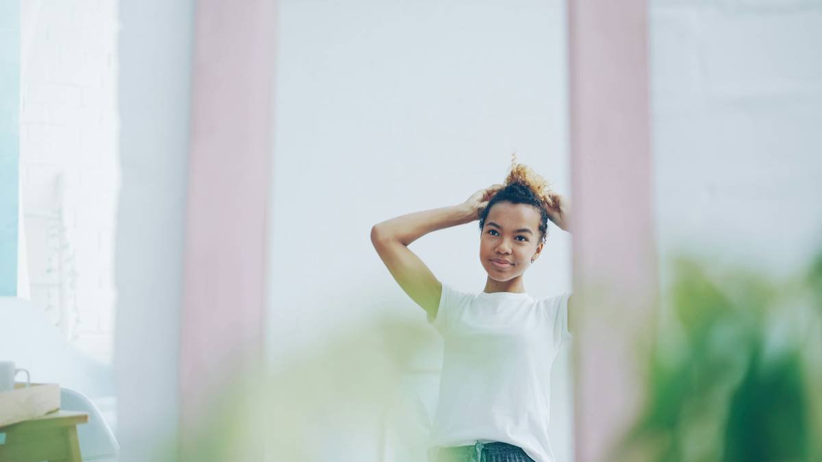 close-up of blended ponytail extension colors showing seamless integration with natural highlighted hair