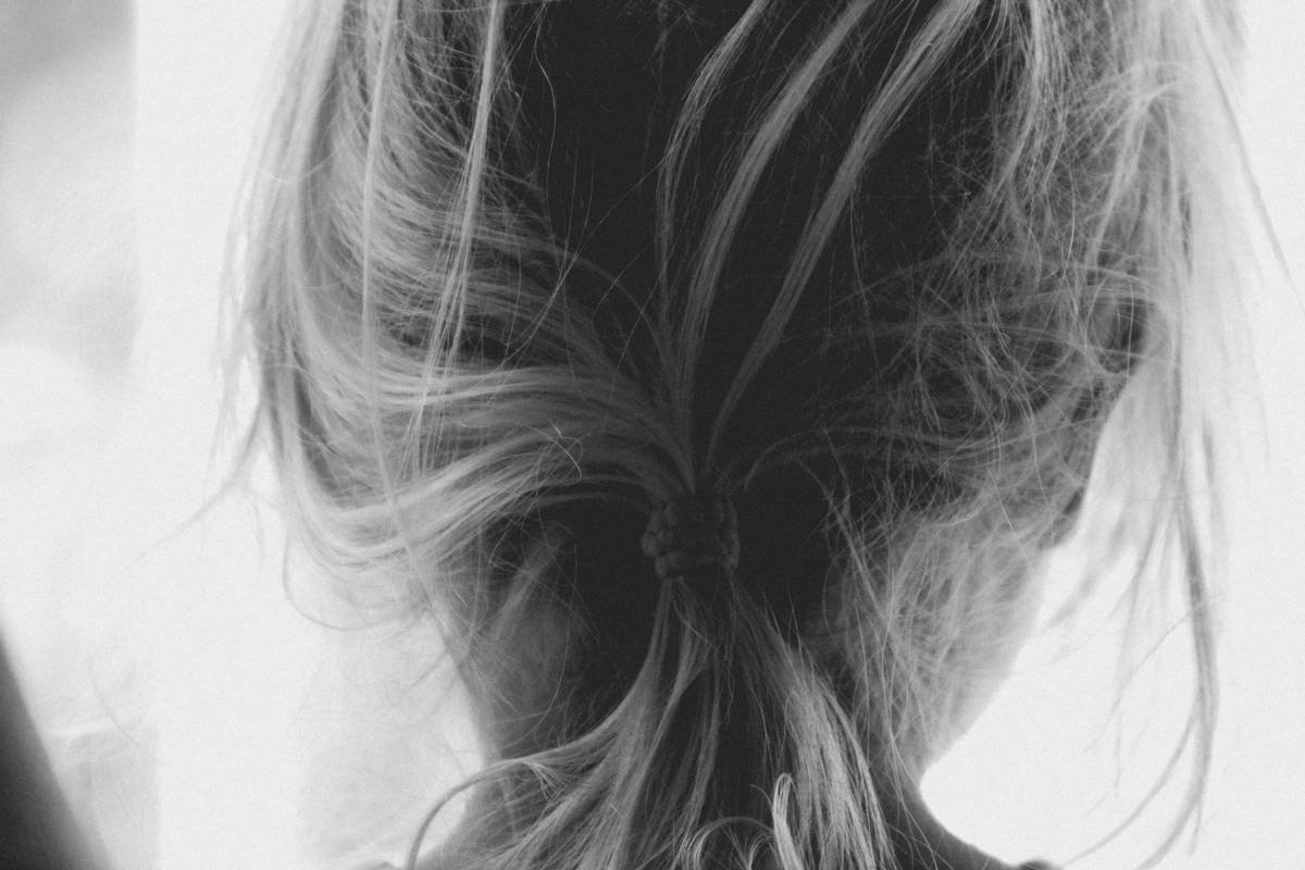 Close-up of casual hair ponytail secured with spiral tie showing zero creasing